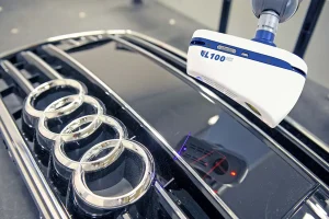 LK Metrology optical laser-scanner on CMM inspecting automotive part